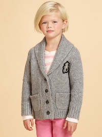This classic cardigan, updated with a sprinkling of sequins and a whimsical rhinestone crest on the chest, offers a twinkling take off on preppy-dom.Shawl collarButton frontChest crestLong sleeeves with ribbed cuffsPatch pocketsPolyester/acrylic/nylon/woolDry cleanImported Please note: Number of buttons may vary depending on size ordered. This classic cardigan, updated with a sprinkling of sequins and a whimsical rhinestone crest on the chest, offers a twinkling take off on preppy-dom.Shawl collarButton frontChest crestLong sleeeves with ribbed cuffsPatch pocketsPolyester/acrylic/nylon/woolDry cleanImported Please note: Number of buttons may vary depending on size ordered.