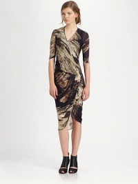 Draped, wool-rich dress in a statement-making print with elbow-length sleeves and an asymmetrical hem. V-neckElbow-length sleevesAsymmetrical hemAbout 33 from natural waist at longest point80% wool/20% nylonDry cleanImported of Italian fabricModel shown is 5'10 (177cm) wearing US size Small. Draped, wool-rich dress in a statement-making print with elbow-length sleeves and an asymmetrical hem. V-neckElbow-length sleevesAsymmetrical hemAbout 33 from natural waist at longest point80% wool/20% nylonDry cleanImported of Italian fabricModel shown is 5'10 (177cm) wearing US size Small.