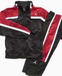 He'll jump into great sport style with this classic Nike track jacket with Jordan logo. He'll jump into great sport style with this classic Nike track jacket with Jordan logo.