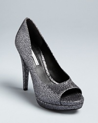 Vera Wang offers a perfect take on the peep toe evening pump style, in luxurious, glittering fabric that will work with denim or dresses. Vera Wang offers a perfect take on the peep toe evening pump style, in luxurious, glittering fabric that will work with denim or dresses.