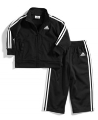 Warm up. He can keep comfy when he's on-the-run with this jacket and pants set from adidas, perfect for playtime. Warm up. He can keep comfy when he's on-the-run with this jacket and pants set from adidas, perfect for playtime.