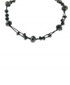 In the black: Embellished with jet enamel beads, 2028's necklace is a versatile style that will look great day and night. Crafted in mixed metal. Approximate length: 16 inches + 3-inch extender.