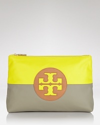 Tory Burch pops and blocks it with this top zip cosmetics case, accented by a bold logo and contrasting neon and neutral hues. It's a bold way to bag your beauty products. Tory Burch pops and blocks it with this top zip cosmetics case, accented by a bold logo and contrasting neon and neutral hues. It's a bold way to bag your beauty products.