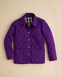 A classic hunter's jacket is refined with Burberry's check lining and a soft quilted shell for traditional cold-weather comfort. A classic hunter's jacket is refined with Burberry's check lining and a soft quilted shell for traditional cold-weather comfort.