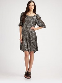 Glittering sequins over breezy chiffon, bring instant glam to this easy blouson frock.Scoopneck Gathered elbow sleeves Dropped waist Slightly gathered skirt About 18 from natural waist Polyester Dry clean Imported Glittering sequins over breezy chiffon, bring instant glam to this easy blouson frock.Scoopneck Gathered elbow sleeves Dropped waist Slightly gathered skirt About 18 from natural waist Polyester Dry clean Imported