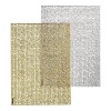 Metallic foil printing creates a shimmering finish on these festive placemats, a glamourous accent for any table.