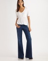 This season's must-have wide-leg silhouette, crafted from gently faded stretch denim.THE FITFitted through hips and thighsRise, about 9½Inseam, about 36THE DETAILSZip flyFive-pocket style68% cotton/30% cupro/2% polyurethaneMachine washMade in USA of imported fabricModel shown is 5'9 (175cm) wearing US size 4.