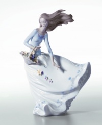 The dynamic movement of this handcrafted piece brings beauty to your home. The perfect gift or addition to your own decor, this porcelain figurine celebrates the splendor of flower petals floating in the wind. Measures 11.25 x 8. The dynamic movement of this handcrafted piece brings beauty to your home. The perfect gift or addition to your own decor, this porcelain figurine celebrates the splendor of flower petals floating in the wind. Measures 11.25 x 8.