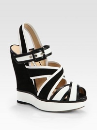 Rich Italian leather and suede combine in this simple two-tone design, with wide crisscrossed straps and a glossy patent platform. Suede-covered wedge, 5¼ (130mm)Patent leather platform, 1¼ (30mm)Compares to a 4 heel (100mm)Leather, suede and patent leather upperAdjustable strapLeather lining and solePadded insoleMade in Italy Rich Italian leather and suede combine in this simple two-tone design, with wide crisscrossed straps and a glossy patent platform. Suede-covered wedge, 5¼ (130mm)Patent leather platform, 1¼ (30mm)Compares to a 4 heel (100mm)Leather, suede and patent leather upperAdjustable strapLeather lining and solePadded insoleMade in Italy