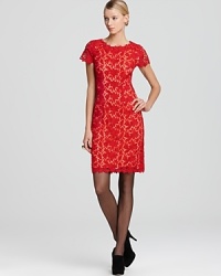 A vibrantly hued lining lends trend-right appeal to a feminine Elie Tahari dress, crafted in crocheted lace. A vibrantly hued lining lends trend-right appeal to a feminine Elie Tahari dress, crafted in crocheted lace.