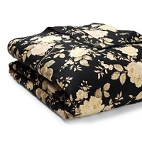 Silhouetted blossoms cascade across a bold black ground with hints of sage, pale yellow and rose on duvets, comforters and shams in this classic bedding collection. Silhouetted blossoms cascade across a bold black ground with hints of sage, pale yellow and rose on duvets, comforters and shams in this classic bedding collection.