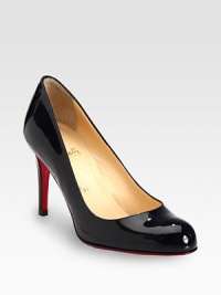 Basic round toe silhouette in lustrous patent leather with intricate stitching and a substantial heel. Self-covered heel, 3½ (85mm)Patent leather upperLeather liningSignature red leather solePadded insoleMade in ItalyOUR FIT MODEL RECOMMENDS ordering one size up as this style runs small. Basic round toe silhouette in lustrous patent leather with intricate stitching and a substantial heel. Self-covered heel, 3½ (85mm)Patent leather upperLeather liningSignature red leather solePadded insoleMade in ItalyOUR FIT MODEL RECOMMENDS ordering one size up as this style runs small.