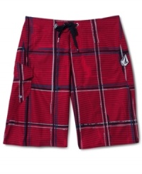 Hit the sand and surf in style with these plaid board shorts by Volcom. Hit the sand and surf in style with these plaid board shorts by Volcom.