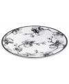 Compose a striking arrangement with the Black Orchid salad plate by Michael Aram. Fine white Limoges porcelain flourishes under a dark watercolor motif inspired by foliage from around the world.
