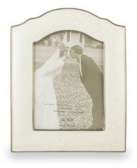 Capture your most magical moment in this medium sized, porcelain frame. Scalloped edges and a luminous finish combine for a truly elegant effect. Capture your most magical moment in this medium sized, porcelain frame. Scalloped edges and a luminous finish combine for a truly elegant effect.