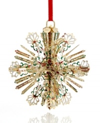 A burst of holiday brilliance, this radiant snowflake ornaments your tree with intricate spokes of gold-plated brass and flourishes of red, white and green. With 2012 hangtag. A burst of holiday brilliance, this radiant snowflake ornaments your tree with intricate spokes of gold-plated brass and flourishes of red, white and green. With 2012 hangtag.