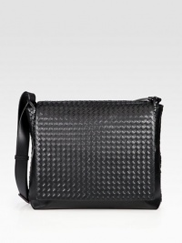 Signature weave of supple Italian leather, crafted in a streamlined messenger style with a versatile crossbody strap.Flap closureAdjustable shoulder strapOne interior pocketCotton liningLeather16W x 13H x 4DMade in Italy Signature weave of supple Italian leather, crafted in a streamlined messenger style with a versatile crossbody strap.Flap closureAdjustable shoulder strapOne interior pocketCotton liningLeather16W x 13H x 4DMade in Italy
