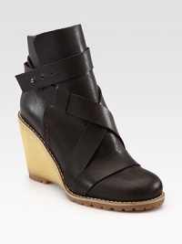 Butter-soft leather is impeccably woven to form this elevated silhouette hitting right above the ankle. Rubber wedge, 3½ (90mm)Leather upperAdjustable tab closureLeather liningRubber trek solePadded insoleImported Butter-soft leather is impeccably woven to form this elevated silhouette hitting right above the ankle. Rubber wedge, 3½ (90mm)Leather upperAdjustable tab closureLeather liningRubber trek solePadded insoleImported