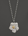 A delicate gardenia, captured at the height of its beauty in sterling silver and 18K yellow gold, blooms on this necklace from Buccellati.