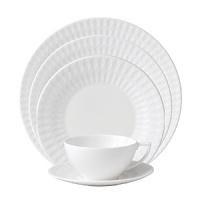 Embossed with clean, geometric patterns comprised of subtle diamond shapes, this attractive set of dinnerware is crafted in pure white bone china for a mannered elegance that complements your finest table setting. Embossed with clean, geometric patterns comprised of subtle diamond shapes, this attractive set of dinnerware is crafted in pure white bone china for a mannered elegance that complements your finest table setting.