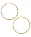 Twisted hoops add a layer of dimension and polish to any look. Crafted in 14k gold with a lever backing. Approximate diameter: 1-1/2 inches.