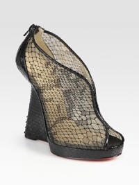 Backed by an exposed zipper, this python wedge has a slight platform, python trim and a semi-sheer lace and mesh upper. Python wedge, 5 (125mm)Python platform, 1 (25mm)Compares to a 4 heel (100mm)Python, mesh and lace upperBack zipperLeather liningSignature red leather solePadded insoleMade in ItalyOUR FIT MODEL RECOMMENDS ordering one size up as this style runs small. Backed by an exposed zipper, this python wedge has a slight platform, python trim and a semi-sheer lace and mesh upper. Python wedge, 5 (125mm)Python platform, 1 (25mm)Compares to a 4 heel (100mm)Python, mesh and lace upperBack zipperLeather liningSignature red leather solePadded insoleMade in ItalyOUR FIT MODEL RECOMMENDS ordering one size up as this style runs small.