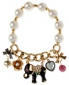 Half stretch, full-on fun. Betsey Johnson's multi-charm bracelet is crafted from antique gold-tone mixed metal and glass pearls, featuring whimsical pieces with glittering accents, such as an elephant and flowers. Item comes packaged in a signature Betsey Johnson Gift Box. Approximate length: 7-1/2 inches.