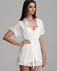 A pretty ivory wrapper trimmed with ruffles. A pretty ivory wrapper trimmed with ruffles.