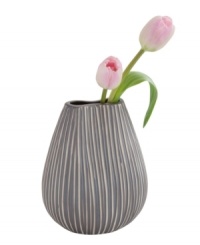 Vertical lines, muted colors and a quirky shape in simple ceramic give the Design Ideas Pinch vase a sense of understated cool. Vertical lines, muted colors and a quirky shape in simple ceramic give the Design Ideas Pinch vase a sense of understated cool.