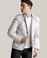 A high-performance, high-on-style coat from Burberry Brit, featuring sporty details like a detachable hood and front cargo pockets--a great layer for up-and-down weather. A high-performance, high-on-style coat from Burberry Brit, featuring sporty details like a detachable hood and front cargo pockets--a great layer for up-and-down weather.