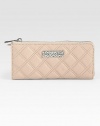 Luxurious leather in an elegant quilted design with a sleek logo plaque.Zip-around closureOne inside zip pocketEight credit card slotsTwo bill compartmentsFully lined7¾W X 3½H X ¾DMade in Italy