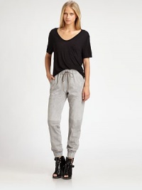 Sportswear has never been so chic. These track pants are rendered in a soft suede silhouette with a drawstring waistband and zippered cuffs. Drawstring elastic waistbandSlash pocketsZippered back cuffsRise, about 10Inseam, about 29SuedeDry clean with leather specialistImportedModel shown is 5'11 (177cm) wearing US size Small. Sportswear has never been so chic. These track pants are rendered in a soft suede silhouette with a drawstring waistband and zippered cuffs. Drawstring elastic waistbandSlash pocketsZippered back cuffsRise, about 10Inseam, about 29SuedeDry clean with leather specialistImportedModel shown is 5'11 (177cm) wearing US size Small.