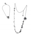 Two styles combine in one polished look. Breil's versatile necklace can be worn as a single heart-shaped sphere or as a long, charm-accented chain. Crafted in polished stainless steel. Approximate length: 14 inches + 4-inch extender. Approximate drop: 1-1/10 inches.