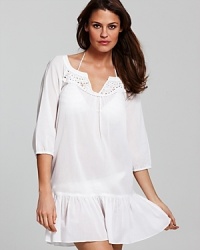 Lace to the finish with this tunic from Shoshanna. Lovely and lightweight, this pop-over keeps you covered while hinting at the suit that lies beneath. Lace to the finish with this tunic from Shoshanna. Lovely and lightweight, this pop-over keeps you covered while hinting at the suit that lies beneath.