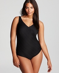 Flaunt your curves in a classic creation with this flattering Gottex one piece. An alluring v neck draws the eye in, while a cleverly crisscrossed bodice hides any imperfections. Flaunt your curves in a classic creation with this flattering Gottex one piece. An alluring v neck draws the eye in, while a cleverly crisscrossed bodice hides any imperfections.