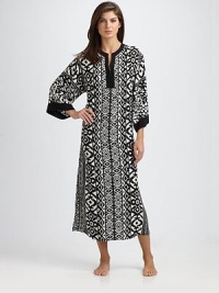 The coziest thing to wrap yourself in, in a soft knit with flattering pleats and dolman sleeves. Scoop neck with lace detail 48, shoulder to hem Lyocell; machine wash Imported The coziest thing to wrap yourself in, in a soft knit with flattering pleats and dolman sleeves. Scoop neck with lace detail 48, shoulder to hem Lyocell; machine wash Imported