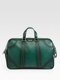 Green hand-stained leather duffel with perforated trim detail.Top zip closureLeather top handleInside pocket with a Gucci crest zipperFive metal feetVelvet Diamante liningLeather20.5W x 12.2H x 8DMade in Italy