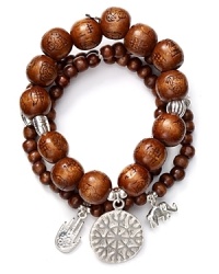Layers of wooden beads and silver charms on Good Charma's bracelets are in perfect step with this season's global influences. Make this set your exotic embellishment of choice. Layers of wooden beads and silver charms on Good Charma's bracelets are in perfect step with this season's global influences. Make this set your exotic embellishment of choice.