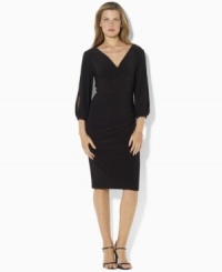 A bold V-neckline and split sleeves create an alluring dress from Lauren by Ralph Lauren, rendered in sleek matte jersey that flatters the figure. A bold V-neckline and split sleeves create an alluring dress from Lauren by Ralph Lauren, rendered in sleek matte jersey that flatters the figure.