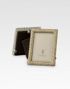 A keepsake accent for life's favorite moments and people, upholstered in smooth leather with 14k gold- or platinum-plating and glimmering Swarovski crystals. Accommodates a 2 X 3 photograph Hand wipe Imported