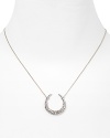 Dazzling Swarovski crystals shine on this horseshoe pendant necklace from Alexis Bittar.