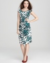 The most chic way to see spots, this Karen Kane dress is designed with a tie-front waist to create sumptuous curves.