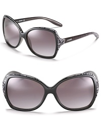 Glam it up in oversized square sunglasses with snake printed trim along top and sides. Glam it up in oversized square sunglasses with snake printed trim along top and sides.