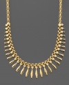A dramatic accent piece with evening wear, this 14k gold necklace features a wealth of jewel-shaped drops in gradiated sizes. Measures approximately 17 inches long.
