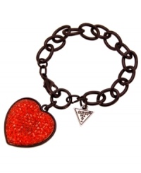 Romantically rebellious. GUESS's dramatic heart bracelet is a total knockout in bright red crystal against a black-plated mixed metal backdrop. Approximate length: 7-1/2 inches. Approximate drop: 1/2 inch. Romantically rebellious. GUESS's dramatic heart bracelet is a total knockout in bright red crystal against a black-plated mixed metal backdrop. Approximate length: 7-1/2 inches. Approximate drop: 1/2 inch.