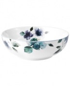 Watercolor florals adorn the canvas of white porcelain that is Mikasa's Paradise Bloom vegetable bowl. A simple silhouette and band of blue complete this essential part of the everyday dinnerware collection.