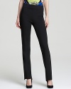 Spice up your workweek uniform with these sleek Elie Tahari pants, finished with high/low cuffs for modern sophistication. Accentuate the on-trend silhouette with pointy-toe pumps.