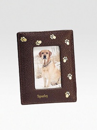 Handcrafted of French goatskin with a golden trail of paw prints, it's an ideal display for the four-legged love of your life. Holds 2¾ X 3¾ photo Made in USAFOR PERSONALIZATIONSelect a color and quantity, then scroll down and click on PERSONALIZE & ADD TO BAG to choose and preview your monogramming options. Please allow 1 week for delivery.