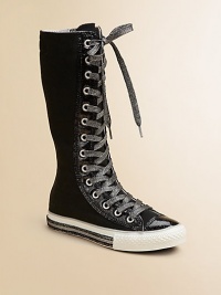 A bold, lace-up design with a signature Chuck Taylor insole and glittery accents. Lace-up style with side zipCanvas upperRubber sole with glitter-coated trimTraditional Chuck insoleImported A bold, lace-up design with a signature Chuck Taylor insole and glittery accents. Lace-up style with side zipCanvas upperRubber sole with glitter-coated trimTraditional Chuck insoleImported