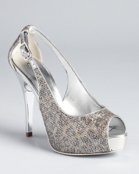 A subtle leopard print gets dressed up with a glimmering, glitter-like texture on GUESS's alluring Hondola platforms. A subtle leopard print gets dressed up with a glimmering, glitter-like texture on GUESS's alluring Hondola platforms.